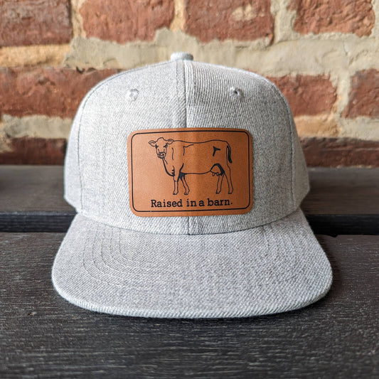 "Raised in a barn" Heather Gray Youth Cow Mesh Trucker Hat